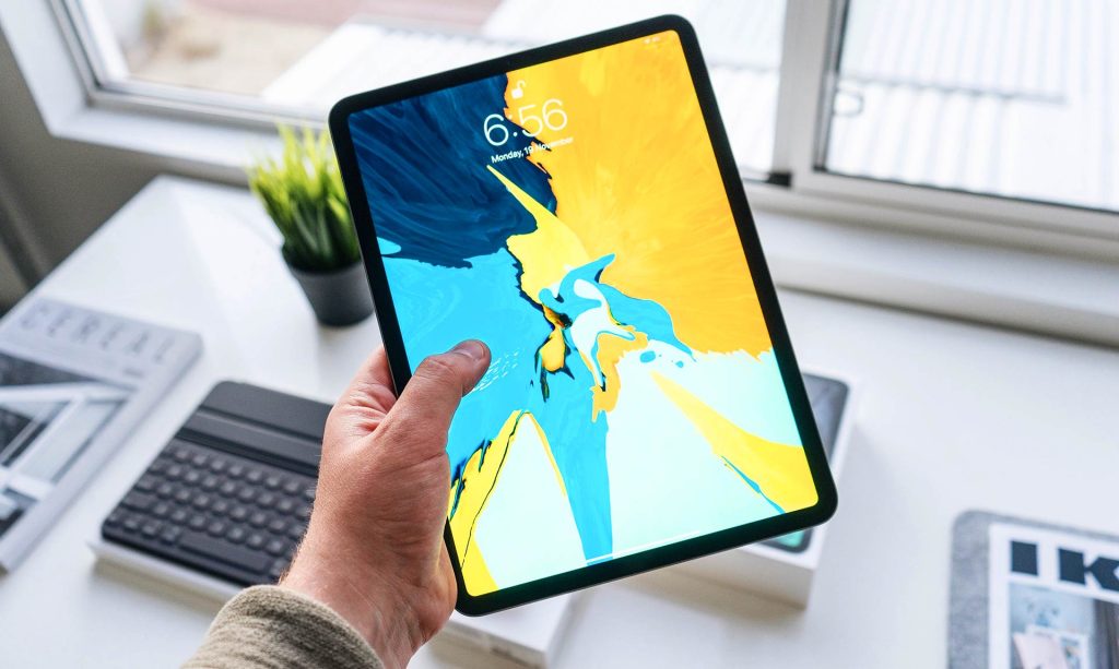 Person Holding Tablet